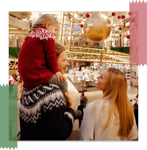 Family enjoying in Christmas set-up in the mall.