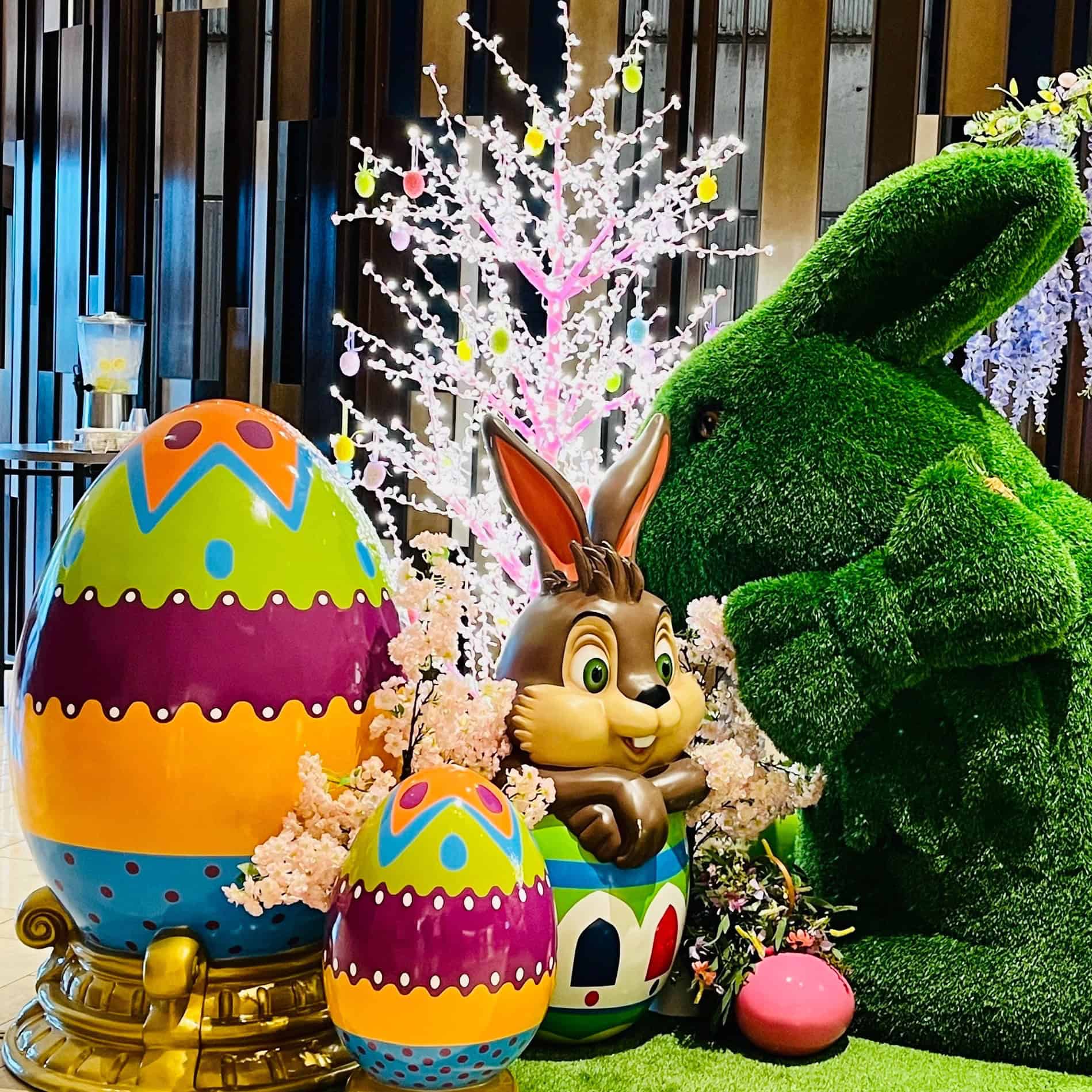 Easter commercial display featuring easter egg, easter rabbit, turf bench.