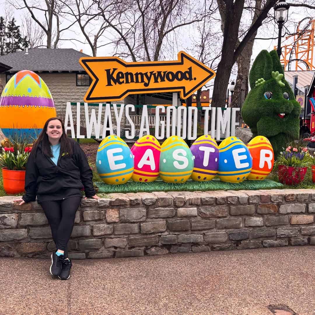 Woman in front of the fiberglass Easter display.